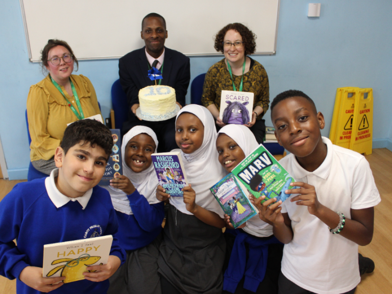 Cabot Primary School principal Felicity Llewelyn-Hodgson, chair of governors Albert Gardiner and Reading Recovery Teacher Gemma Davies with pupils at the celebrations