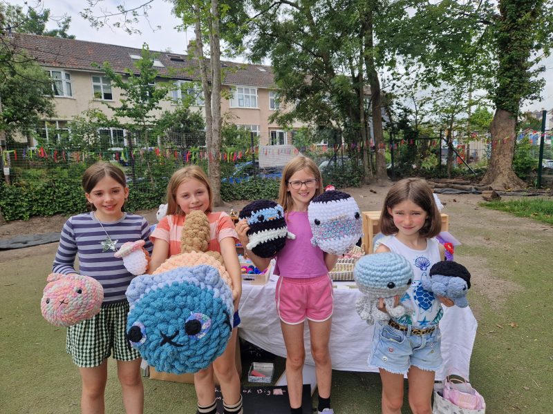 Mara, 9, Poppy, 9, Ivy, 9, and Emily, 8, with some of their wares
