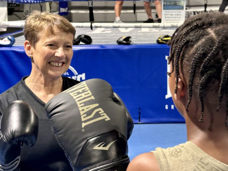 Police and Crime Commissioner Clare Moody dons boxing gloves for a visit to Empire Fighting Chance aimed at supporting young people by providing coaching and mentoring